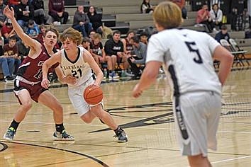 T-Birds boys’ basketball uses 34-6 run to beat Cardinals