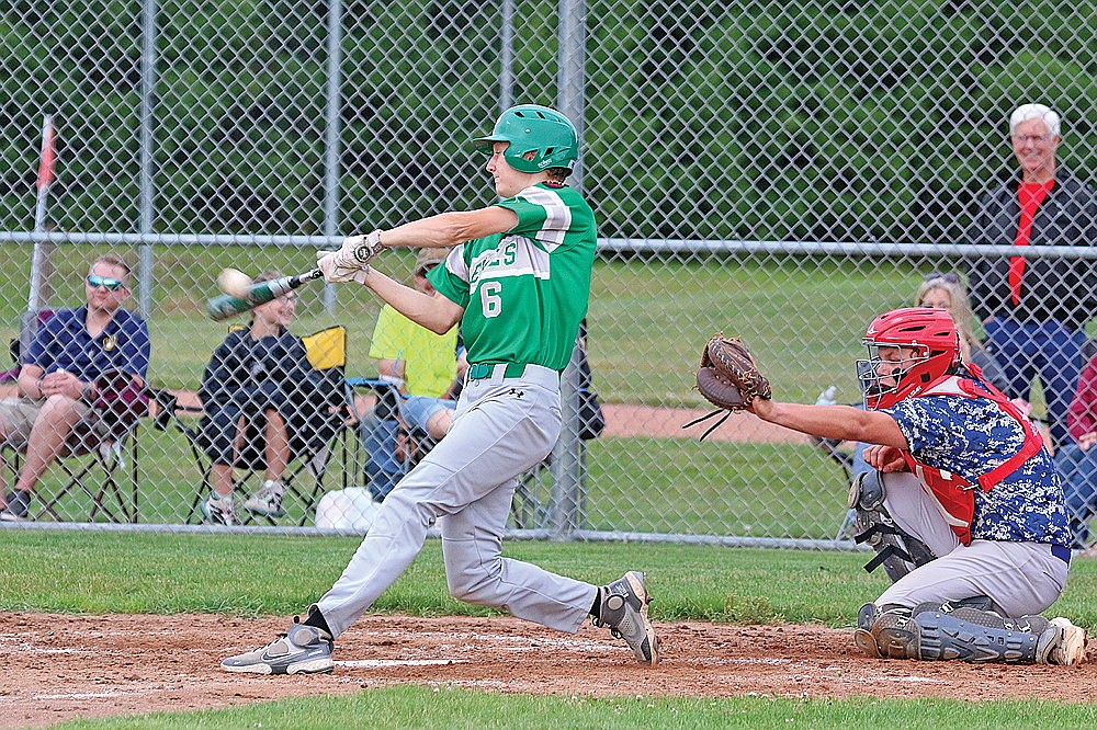 Rhinelander’s Ryan Jamison hits a triple during the fifth inning of an American Legion baseball game against Northwoods in Eagle River Tuesday, July 11. The Rebels broke a 2-all tie in the fourth and defeated the Eagles 5-2 on Tuesday. (Jeremy Mayo/River News)