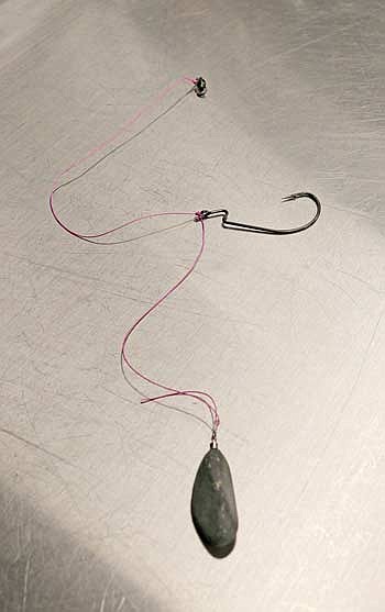 A 10-inch worm, such as this one in changeable violet color, can be just the thing to get midsummer largemouth to commit to a soft plastic bait. (Photo by Beckie Gaskill/Lakeland Times)