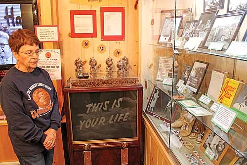 Dr. Kate Museum curator Marsha Doud reflects on different artifacts showcased at the museum highlighting the local legend Dr. Kate Newcomb. (Photo by Trevor Greene/Lakeland Times)