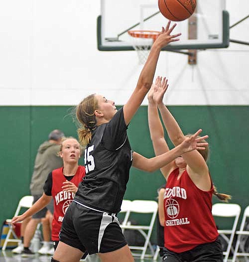 Savannah Kemnitz takes a shot during the first half against Medford during the Tuesday Night League Tuesday, July 18 at Greenheck Field House in Schofield. (Photo by Brett LaBore/Lakeland Times)