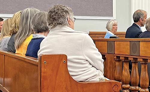 The Board of Canvassers of the Town of Presque Isle, left, and Lorine Walters, center, listen to attorney Christopher Blythe during a hearing in the case of incumbent town chairman John MacLean’s appeal of an April 12 recount of the April 4 election results at the Vilas County Courthouse on Wednesday, July 19, in Eagle River. (Photo by Trevor Greene/Lakeland Times)