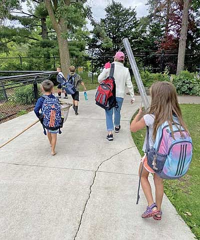 My friend Linda and I took some kids out to a local stream to do some stream moni- toring for the first day of our Riparian Rangers Camp. (Photo by Beckie Gaskill/Lakeland Times)