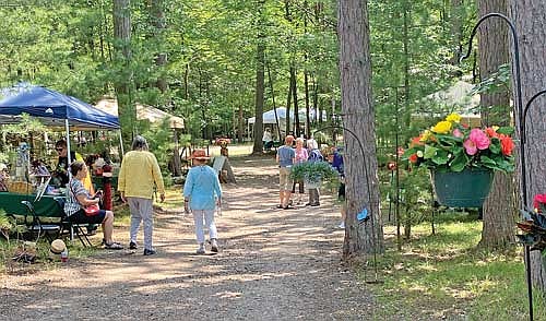 Beckie Gaskill of The Lakeland Times was invited to Garden Fest — the Lakeland Gardeners annual fundraiser — this year. The event was well attended, with many people stopping by Gaskill’s booth to talk about butterflies. (Photo by Beckie Gaskill/Lakeland Times)