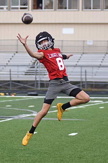 Deklan McQuade looks to haul the football in during a defensive drill on the first day of practice Tuesday, Aug. 1 at IncredibleBank Field in Minocqua. (Photo by Brett LaBore/Lakeland Times)