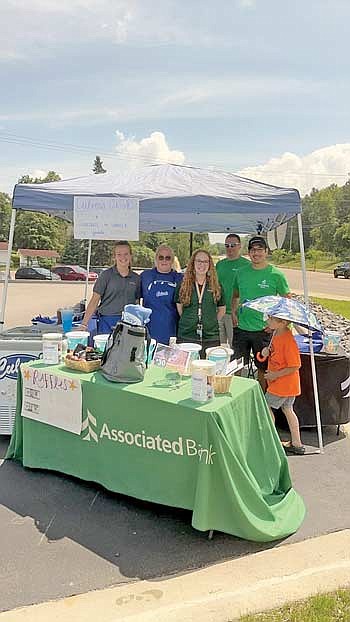Employees of the Rhinelander branch of Associated Bank participated in a companywide Volunteer Day of Service on July 26. (Submitted photo)