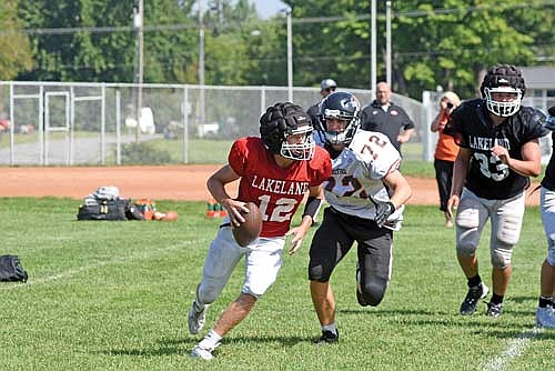 Kort Meyer moves out of the pocket in a scrimmage vs. Stratford Friday, Aug. 11 at D.C. Everest Junior High School in Weston. Meyer enters the 2023 season as Lakeland’s starting quarterback. (Photo by Brett LaBore/Lakeland Times)
