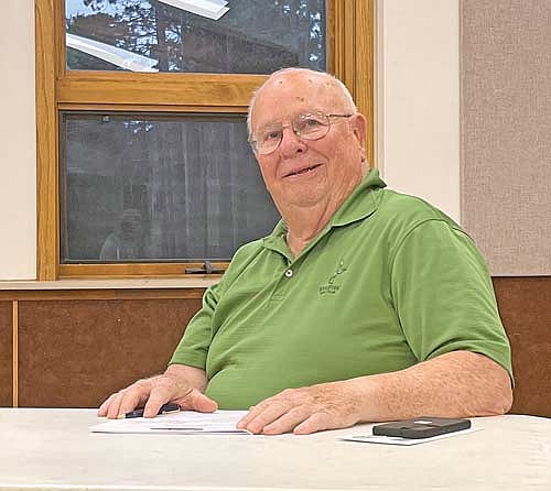 Town supervisor Bob Becker receives a round of applause after his resignation from the town board was announced during a meeting on Tuesday, Aug. 8, in Manitowish Waters. (Photo by Trevor Greene/Lakeland Times)