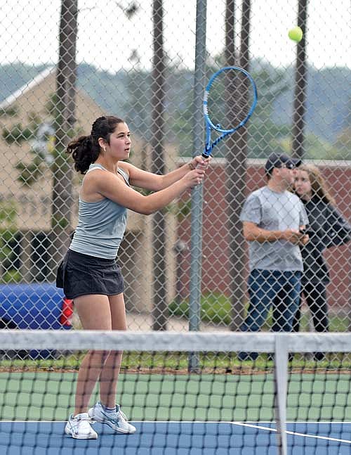 Sam Bridgwater hits a groundstroke in her No. 4 singles victory over Merrill Thursday, Aug. 17 at Merrill High School. The win gave Bridgwater her first career varsity victory. (Photo by Brett LaBore/Lakeland Times)