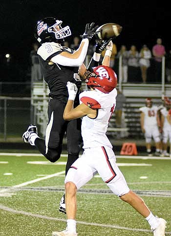 Maccoy Holmquist tries to make a catch over Wausau East’s Brady Prihoda in the fourth quarter Friday, Aug. 18 at IncredibleBank Field in Minocqua. Holmquist caught a touchdown in the first quarter. (Photo by Brett LaBore/Lakeland Times)