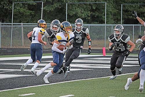 Greyson Allen stops Tomahawk's Brayden Larson for a near safety during the second quarter Friday, Aug. 25 at IncredibleBank Field in Minocqua. (Photo by Trevor Greene/Lakeland Times)