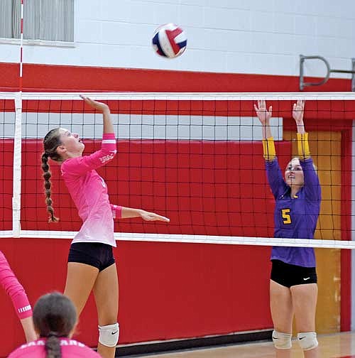 Sloane Timmerman rises for an attack on the ball vs. Ladysmith’s Miranda Grotzinger during the second set of a quad Tuesday, Aug. 29 at Marathon High School. Lakeland defeated Ladysmith, Neillsville and Marathon. (Photo by Brett LaBore/Lakeland Times)
