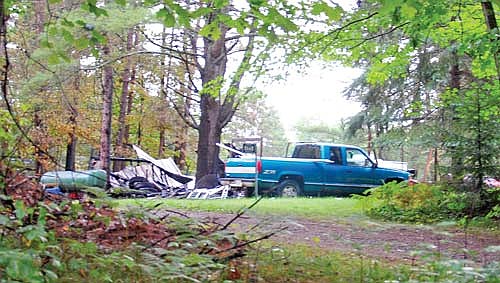 The Pinkhurst Drive site of Tuesday’s garage fire on Minocqua’s west side. The propane tank is to the left of the photo. (Photo by Brian Jopek/Lakeland Times)
