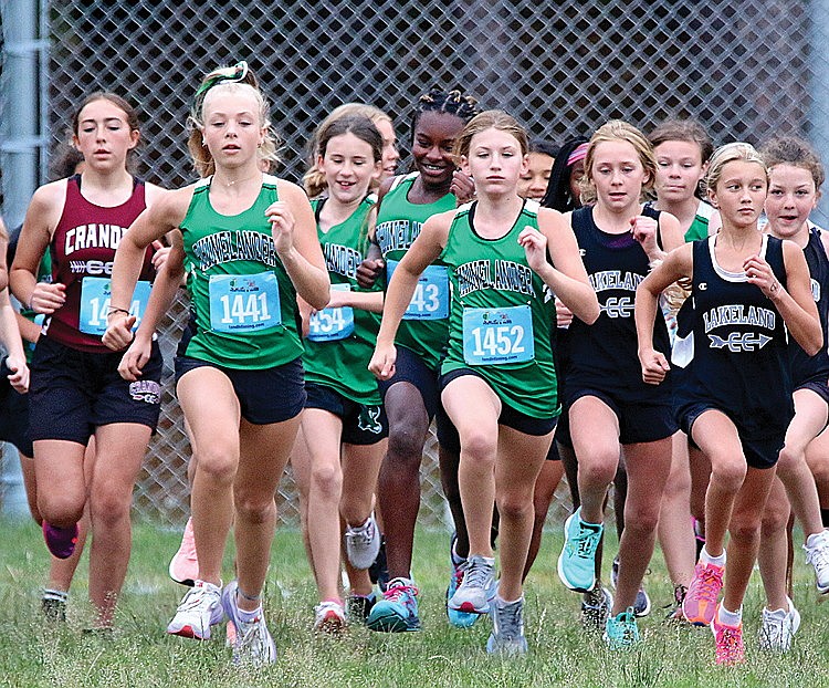 The Hodag girls’ pack, led by Teagan Clark (1441), Quinn Steinbrink (1454), Noella Tulowitzky (1443) and Noelle Mayo (1452) leaves from the starting line of the Rhinelander Invite middle school cross country race at Rhinelander High School Thursday, Sept. 7. (Jeremy Mayo/River News)