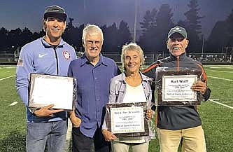 Kurt Wulff, Kevin Bolger and Pam and Ken Schoville were honored as the newest inductees into Lakeland Union High School’s Wall of Fame during a ceremony at halftime of the Mosinee/Lakeland football game Friday, Sept. 1 at IncredibleBank Field in Minocqua. Pictured, from left, are Bolger, Ken Schoville, Pam Schoville and Dan Clausen, standing in for Wulff. (Photo  by Brett LaBore/Lakeland Times)