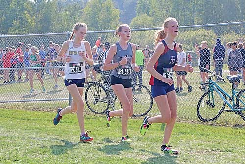 Sherri Handeland, middle, runs in-between two competitors during the Smiley Invitational Saturday, Sept. 16 at Wausau East High School. Handeland had a 20-second PR and time of 22:16.5. (Photo by Jeremy Mayo/River News)