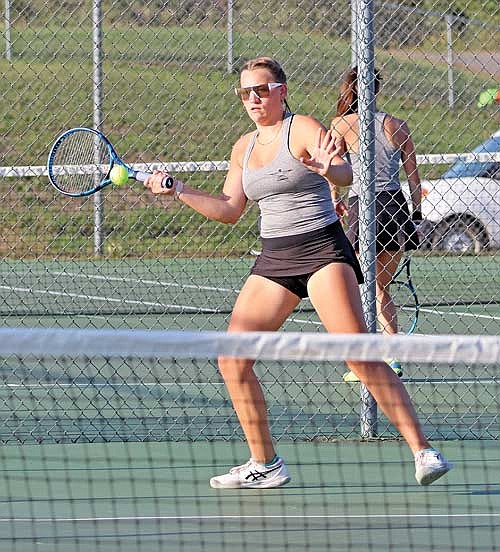 Sarah Barton keeps focused on the tennis ball in her No. 1 singles match against Medford Thursday, Sept. 14 at Medford Area Senior High School. Barton won 6-1, 6-0. (Photo by Matt Frey/Star News)