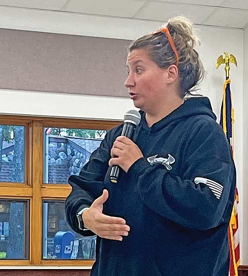 Jessie Mabie, EMS service director for the Manitowish Waters Fire Company, speaks in support of forming a four-town EMS district during a public hearing on Tuesday, Sept. 12, in Manitowish Waters. (Photo by Trevor Greene/Lakeland Times)