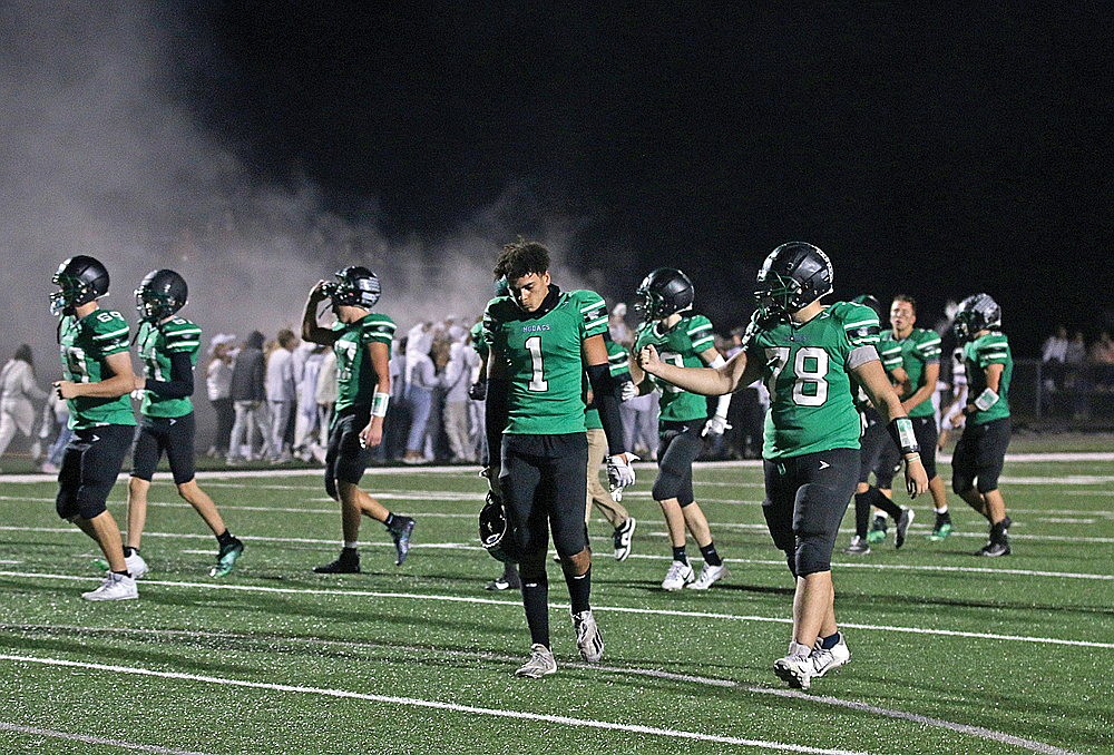 Members of the Rhinelander High School football team, including Owen Ives (1) and Calvin Welch (78) walk off the field after the Hodags lost to Antigo 24-0 in the 89th playing of the Bell Game at Mike Webster Stadium Friday, Sept. 15. (Bob Mainhardt for the River News)