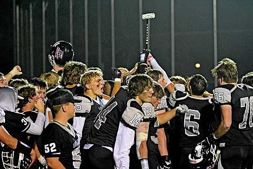 The Thunderbirds hold up the hammer after a 35-0 victory over Merrill Friday, Sept. 15 at IncredibleBank Field in Minocqua. (Photo by Brett LaBore/Lakeland Times)
