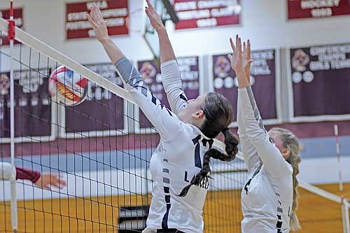 Meg Pfannerstill, left, blocks an Antigo attack in the fourth set with Stina Peterson also in defense of a 3-1 win Tuesday, Sept. 19 at Sheldon Fieldhouse in Antigo. (Photo by Brett LaBore/Lakeland Times)