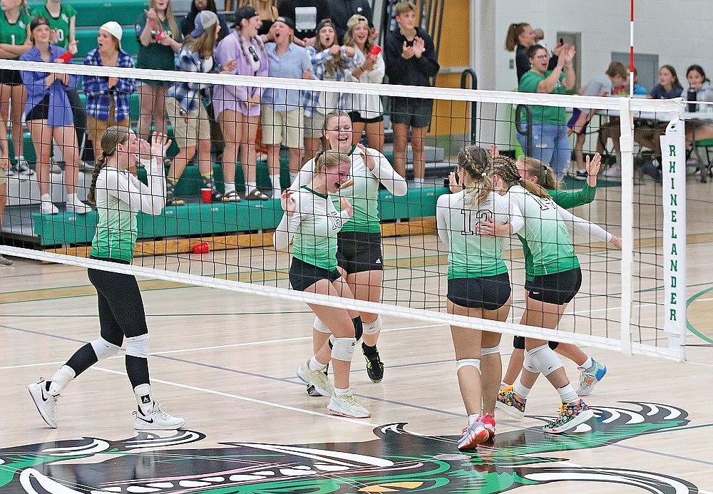The Rhinelander High School volleyball team celebrates after winning a set against Northland Pines during a GNC volleyball match at the Jim Miazga Community Gymnasium Tuesday, Sept. 19. The Hodags defeated the Eagles in three sets, claiming their first GNC victory since 2017. (Bob Mainhardt for the River News)