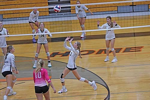 Meela Khan prepares to set the ball to a teammate as Stina Peterson, left, and Avery McKinney (10) watch in the second set against Florence during the Phillips Invite Saturday, Sept. 23 at Phillips High School. The Thunderbirds beat the Ladycats 2-0 to finish in third place. (Photo by Brett LaBore/Lakeland Times)