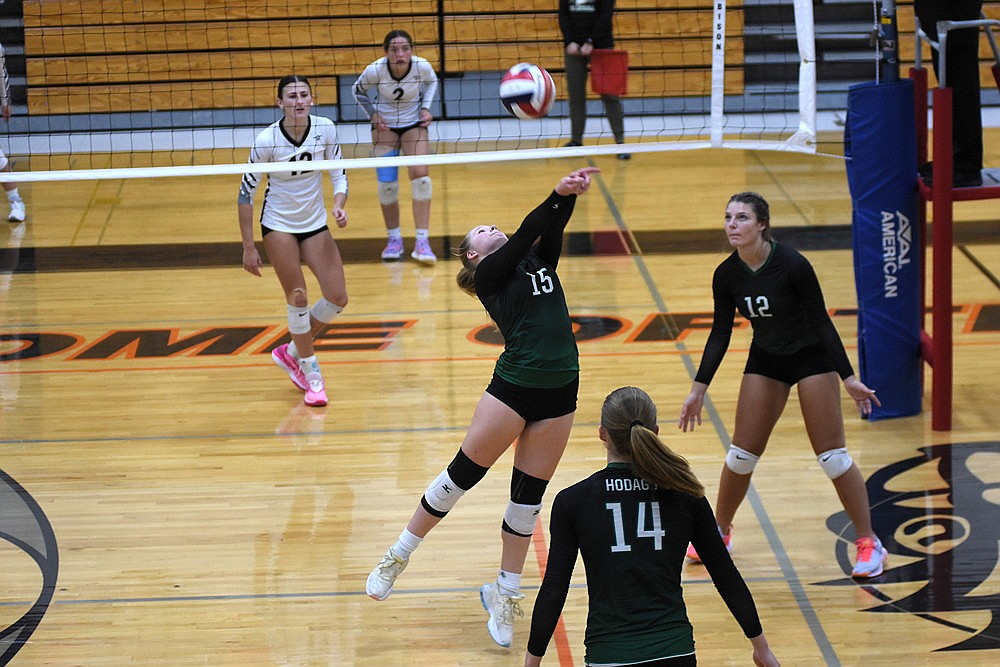 Rhinelander's Lucy Lindner bumps the ball over the net during a match against Lakeland at the Logger Invite in Phillips Saturday, Sept. 23 (Brett LaBore/Lakeland Times)