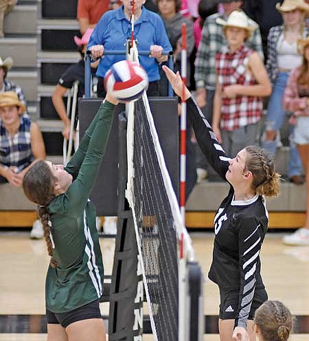 Ava Evenhouse, right, powers down a kill past D.C. Everest’s Isabella Kraege in the fourth set Tuesday, Sept. 26 at the Lakeland Union High School fieldhouse in Minocqua. (Photo by Brett LaBore/Lakeland Times)