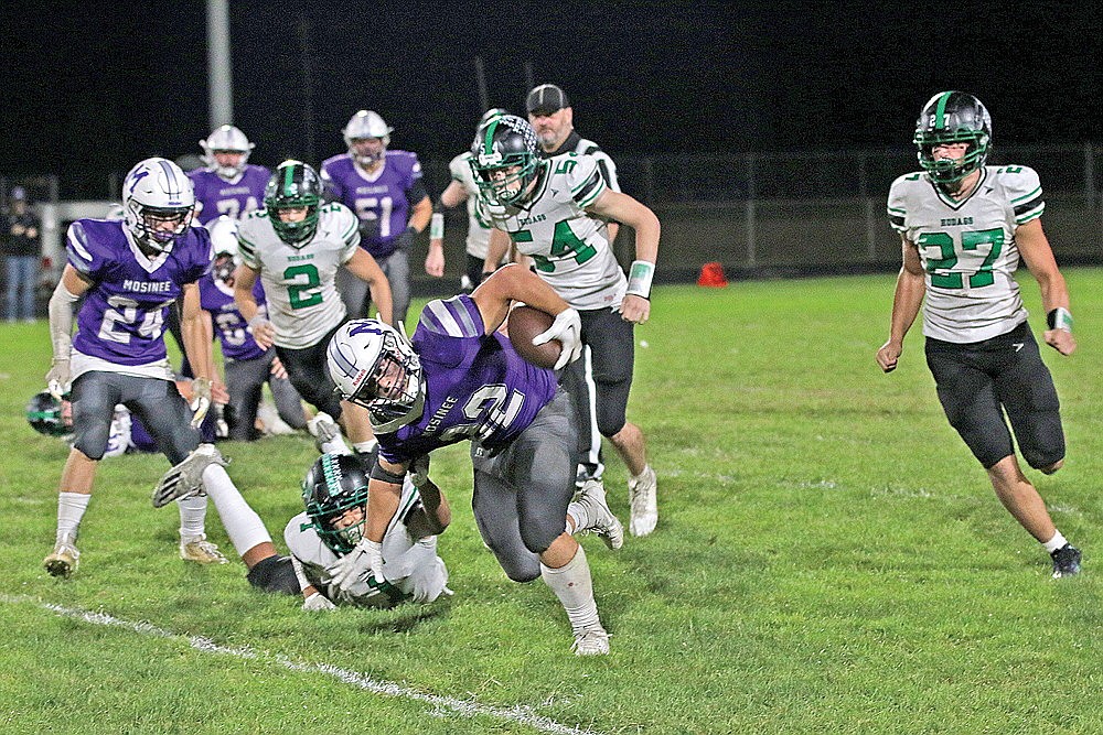 Mosinee’s Wyatt Harris attempts to run out of a tackle attempt by Rhinelander’s Owen Ives during the second half of a GNC football game in Mosinee Friday, Sept. 22. The Hodags’ run defense will face a tough challenge tonight against a Medford team that is averaging more than 366 yards per game on the ground and has four of the top seven rushers in the conference. (Bob Mainhardt for the River News)