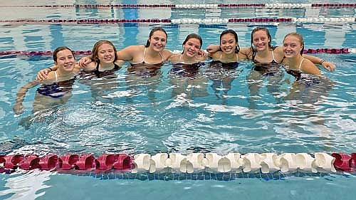 Lakeland swimmers, from left, Avalon Collins, Greta Pritchard, Sophia Gyuro, Jadyn Wentland, Olivia Mickle, Molly Jorgensen and Saylor Timmerman celebrate their win over Antigo Thursday, Sept. 28 at the Clara R. McKenna Aquatic Center in Antigo. The Thunderbirds won their first conference dual meet since Oct. 7, 2021. (Contributed photograph)