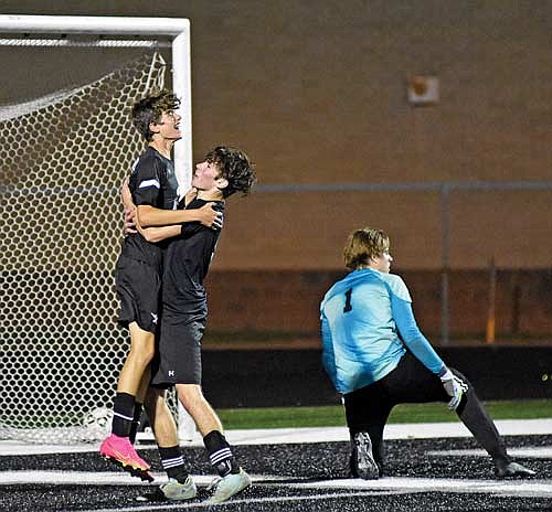 Oren Slemmons, left, and Cam Bernard celebrate a goal by Slemmons in the second half of a 3-0 win against Rhinelander Tuesday, Oct. 3 at IncredibleBank Field in Minocqua. Lakeland scored all three of their goals in the second half to beat Barak Rappley (1) and the Hodags. (Photo by Brett LaBore/Lakeland Times)