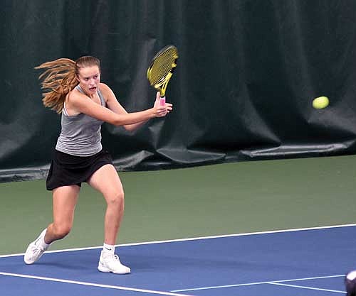 Kristina Ouimette hits a groundstroke in her No. 1 doubles match against Menomonie during a WIAA Division 1 sectional meet Wednesday, Oct. 4 at John and Fay Menard YMCA Tennis Center in Eau Claire. Ouimette and partner Savannah Barton advanced to state on a special qualifier. (Photo by Brett LaBore/Lakeland Times)