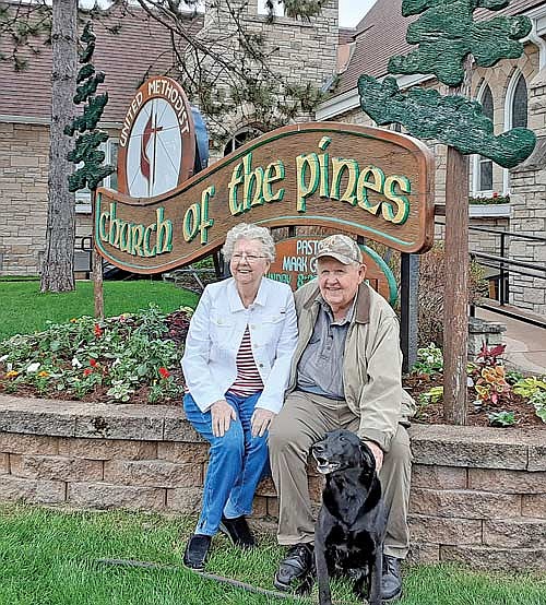 James “J.J.” and Barbara Jurries in front of the Church of the Pines flower garden on May 23, 2020. (Contributed photograph)