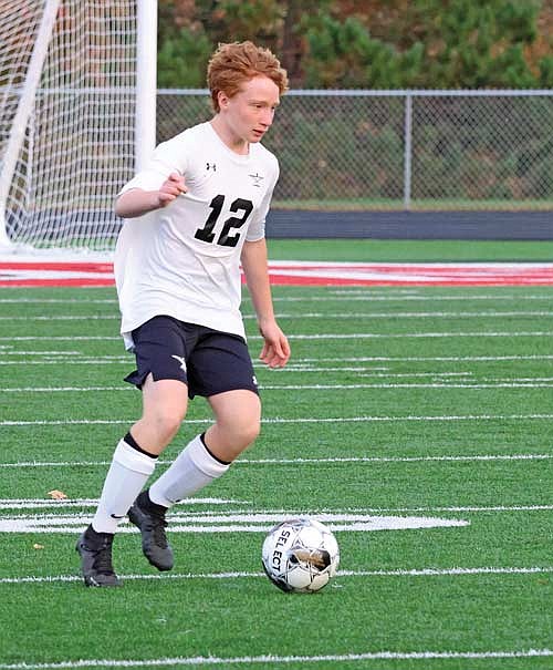 Connor Erickson dribbles through the midfield in a 4-0 win over Medford Thursday, Oct. 5 at Raider Field in Medford. The Thunderbirds allowed zero shots on target, zero shots in general in the win. (Photo by Matt Frey/Star News)
