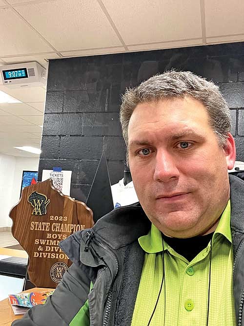 River News sports editor Jeremy Mayo is pictured with the trophy after the Rhinelander High School boys’ swim team won the 2023 WIAA Division 2 state championship in Waukesha last February. Mayo was chosen by the RHS student council to serve as grand marshal for the homecoming parade, which is set to take place at 4 p.m. today in downtown Rhinelander. (Submitted photo)