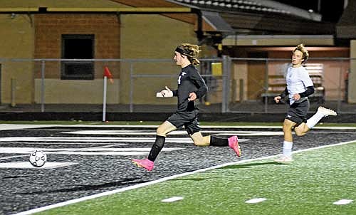 Cody Harris runs to the ball in the second half of a 7-0 win over Antigo Thursday, Oct. 12 at IncredibleBank Field in Minocqua. Harris scored a goal in his first game back from injury. (Photo by Brett LaBore/Lakeland Times)