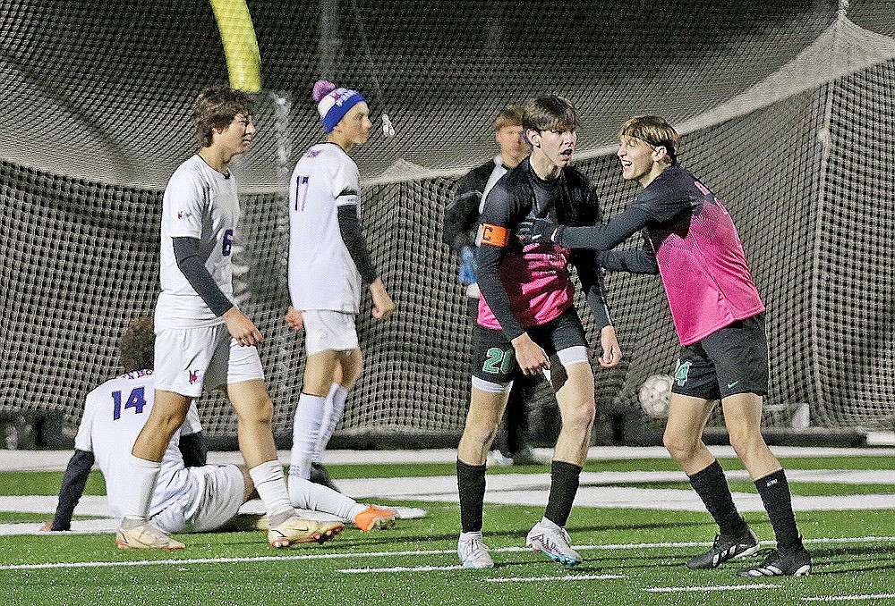 Rhinelander’s Matthew King receives congratulations from teammate Will Gretzinger after scoring a goal in the second half of a GNC boys’ soccer game against Northland Pines at Mike Webster Stadium Thursday, Oct. 12. King’s second-half goal was the difference as the Hodags ended the regular season with a 2-1 win over the Eagles. (Bob Mainhardt for the River News)