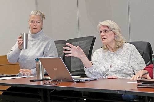 Vilas County land and water conservation committee member Carolyn Ritter asks for clarification on a grant resolution regarding the 2024 Boat Decontamination Program as department head Carolyn Scholl (left) provides that background. (Photo by Beckie Gaskill/Lakeland Times)