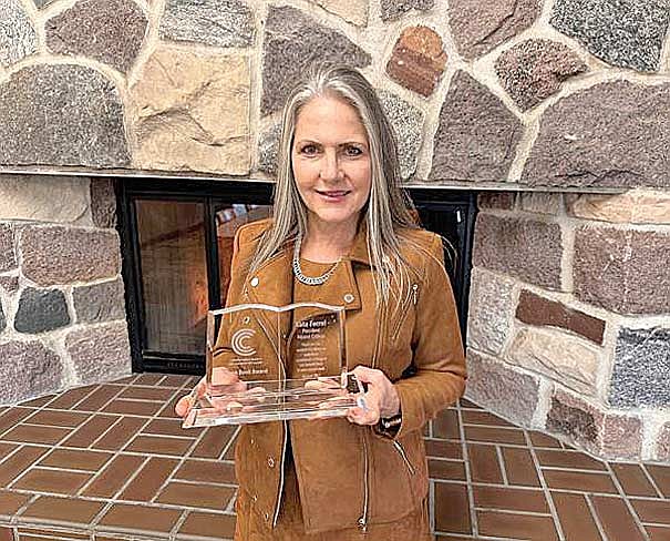 Nicolet College President Kate Ferrel accepted the Open Book Award from CBExchange. (Submitted photo)