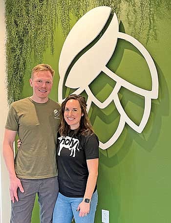 Ty and Kelly Knobeck recently opened the Bottled Bean on the corner of Chippewa Street and Menominee Street. (Photo by Trevor Greene/Lakeland Times)