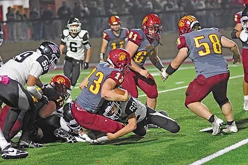 Carmelo Roche-Vetterneck tackles Sparta’s Thomas Laufenberg in the third quarter during a WIAA Division 3 Level 1 playoff game Friday, Oct. 20 at Sparta Memorial Park Field. (Photo by Brett LaBore/Lakeland Times)