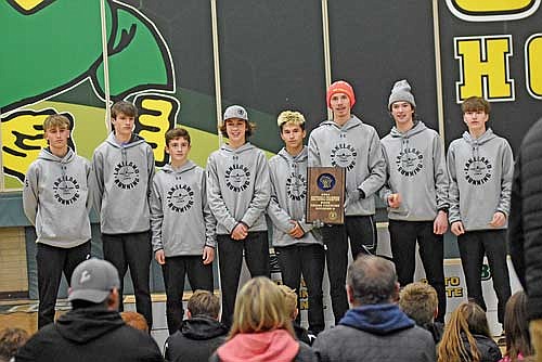 The Thunderbirds are honored as champions of a WIAA Division 2 sectional meet Saturday, Oct. 21 at Colby High School. It is Lakeland’s second straight sectional championship, punching their ticket to state. Thunderbirds pictured, from left, are Ashton Bremer, Ati Gyuro, Charlie Ernst, Parker McKinney, Justin Funmaker, Owen Clark, Levi Reimer and Zach Kline. (Photo by Brett LaBore/Lakeland Times)