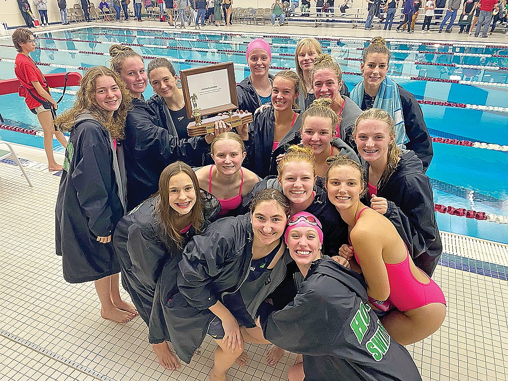 The Rhinelander High School girls’ swim team poses with the Great Northern Conference championship trophy following the conference meet in Antigo Friday, Oct. 20. Pictured in the front are Claire Caselton and Margaret Lambert. In the second row are Celia Francis, Millie Gruett and Ella Heck. In the third row are Lily Thorsen, Emma Houg and Kiley Pooch. In the fourth row are Ellyse Younker, Abi Winnicki, Sam Sundby, June Chiamulera and Vivian Lamers and in the back row are Rylee Mickevicius, Abbie Ames and Karis Francis. The Hodags won nine events and took the meet by 210 points over runner-up Medford. (Submitted photo)