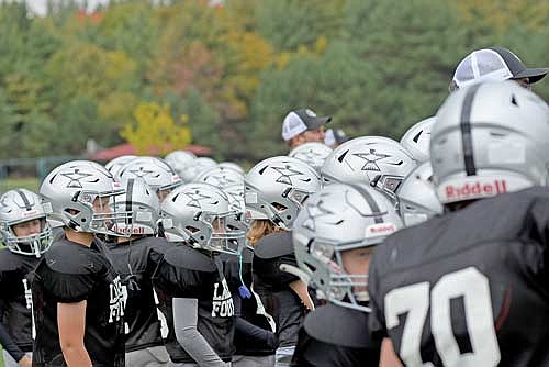 The Thunderbirds gather on the sidelines in the first half during a game against Wisconsin Rapids Saturday, Sept. 30 at Minocqua-Hazelhurst-Lake Tomahawk Elementary School in Minocqua. Players facing forward, pictured from left, are Wyatt Trapp, Brayden McNew and Jase Kutschenreuter. (Photo by Brett LaBore/Lakeland Times)