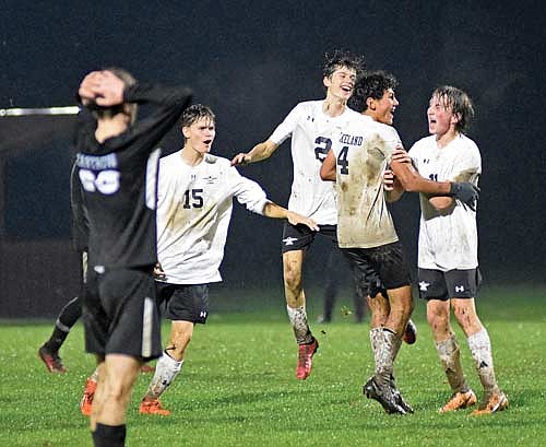 The Thunderbirds celebrate a goal by Dominic Gironella (4) in the first half of a WIAA Division 3 sectional semifinal game against Mosinee Thursday, Oct. 26 at Edgewood Field in Mosinee. Thunderbirds, pictured from left, are Sawyer Brown, Oren Slemmons, Gironella and Marshall Holmquist. (Photo by Brett LaBore/Lakeland Times)