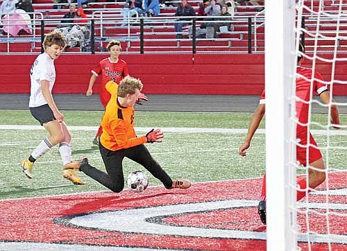 Yaroslav Myshchyshyn scores a goal through the legs of Medford keeper Cale Schulz Thursday, Oct. 5 at Raider Field in Medford. Myshchyshyn won GNC Offensive Player of the Year for the third straight season. (Photo by Matt Frey/Star News)