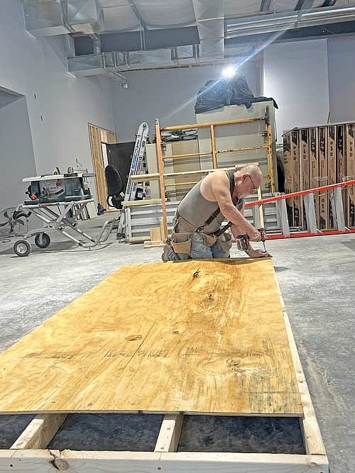 Ron Sauer makes a temporary door during the construction of a new church on Tuesday, Oct. 31, in Lake Tomahawk. (Photo by Trevor Greene/Lakeland Times)