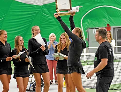 In this Sept. 21, 2023 file photo, the Thunderbirds celebrate their conference championship at the GNC Tournament inside the Hodag Dome in Rhinelander. Thunderbirds, from left, are Charley Cleveland, Norah Strasburg, Kristina Ouimette, Savannah Barton and Sarah Barton, lifting the trophy. (Photo by Brett LaBore/Lakeland Times)