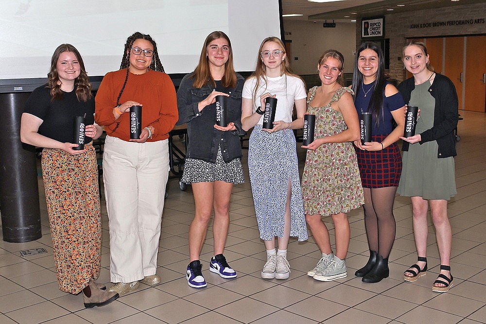 The seniors of the Rhinelander High School volleyball team pose with their gifts following the team’s season-ending banquet in the RHS commons Wednesday, Nov. 1. Pictured, from left to right, are Maddie Ewan, Mya Krouze, Lily Treder, Lexi Robinson, Emma Chiamulera, Ava Krouze and Alyssa Smits. (Bob Mainhardt for the River News)